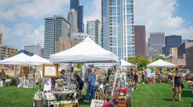 Outdoor festival with people and tents