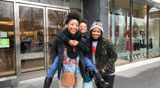Young family posing outside