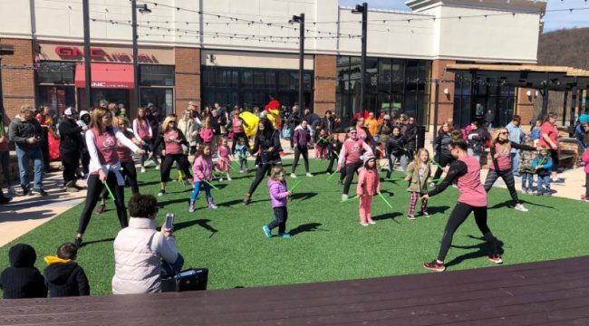 Group of children and adults outside playing